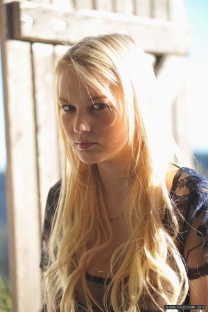 Sweet slender blonde demonstrates her trimmed pussy and round breasts