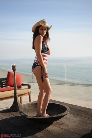 Sexy girl in USA themed swimwear reveals small breasts and smooth peach