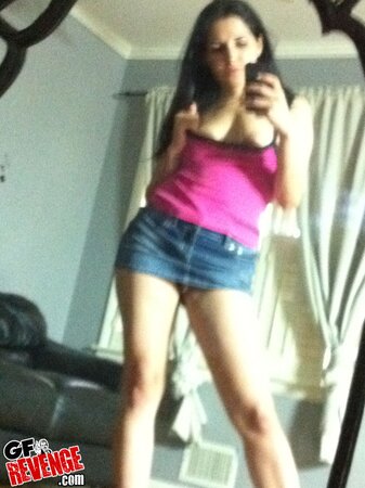 Tempting brunette gal flaunts her trimmed pussy and tits in front of the mirror