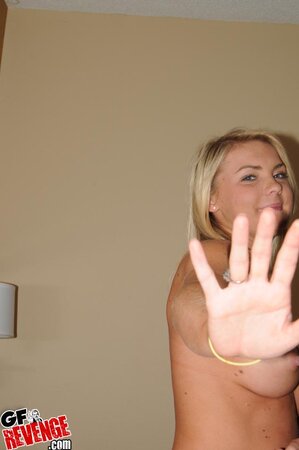 Hot blonde chick tries on new clothes showing off her round booty and big tits
