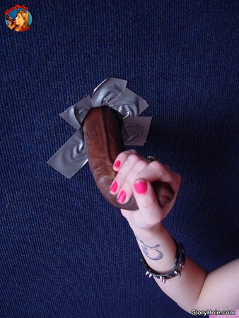 Glamorous teen in glasses polishes black dick with no clue who is behind the wall