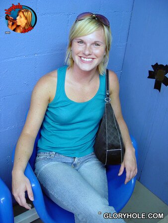 Pretty blond nympho masturbates and blows black pecker in a gloryhole room
