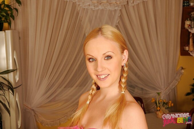 Lovely blond with pig tails removes nightie to tease with her teen curves