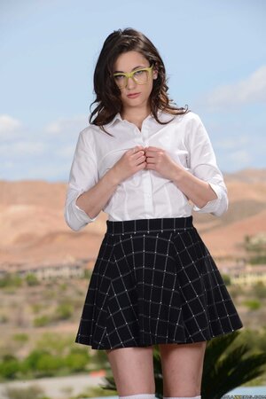 Nerdy schoolgirl doffs clothes to showcase tiny tits and juicy pussy