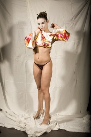 Lustful girl in Japanese geisha outfit reveals her tempting young curves