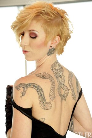 Skinny inked blonde in stockings licks and rides dildo on the Magic Ball