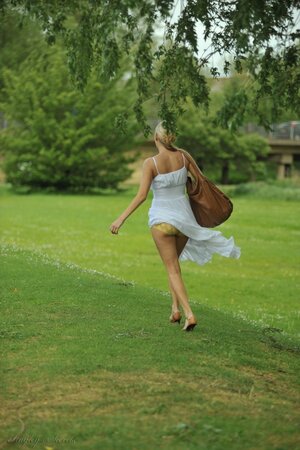 Hot blond beauty eats an ice cream while baring awesome tits after long walk