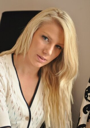Lecherous blond gal sensually poses naked to reveal her sweetest parts