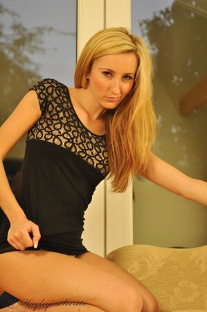 Charming blond gal flaunts perky tits and pussy before getting dressed