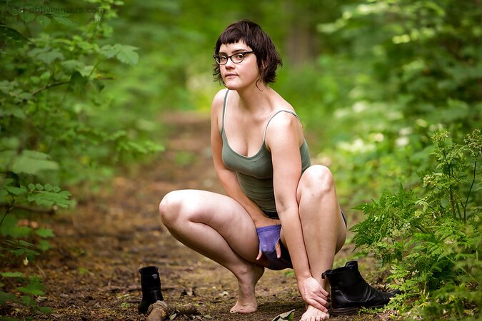 Skinny brunette is going to finger herself while outside