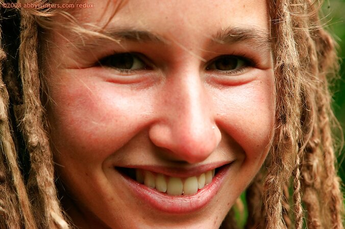 All natural girl with dreadlocks showing her bush and pits