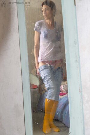 Self conscious looking girly girl  shows her thin body here