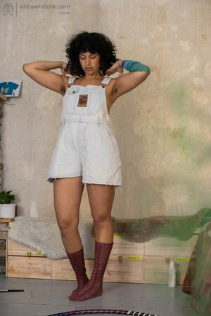 Curly hair chick is going to show her meaty ass from behind