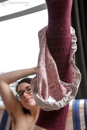 Brunette with cute knee highs is going to show what she has