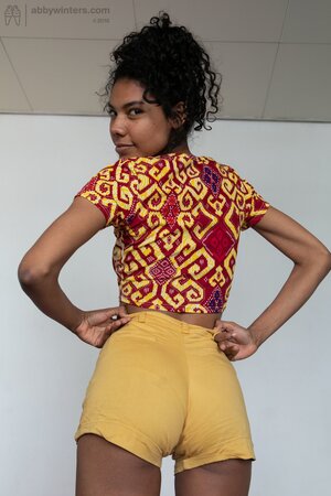 African stunner showing her small breasts and juicy twat