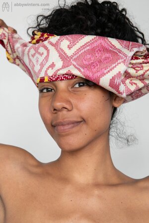 African stunner showing her small breasts and juicy twat