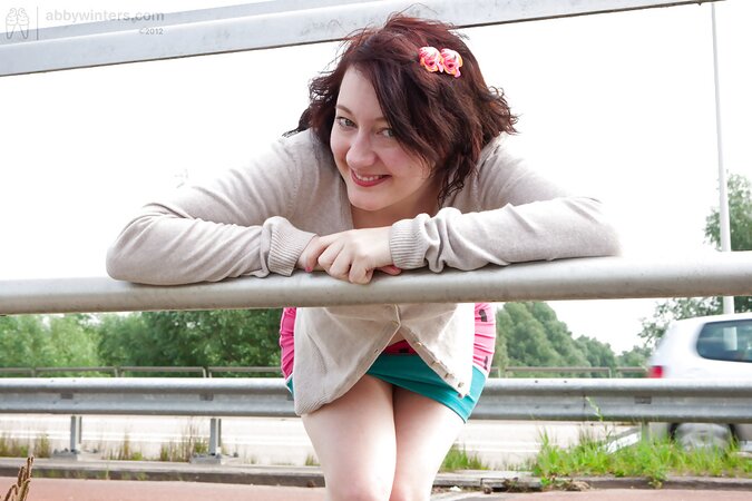 Well developed and sensual woman wearing a sexy outfit outside