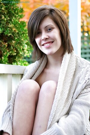 Brunette with a sexy smile showing her bush along the way