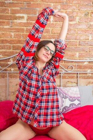 Adorable girl with a special brand of charm is showing her body