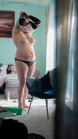Curvy redhead Breanna is going to show her black panties too
