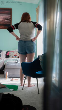Curvy redhead Breanna is going to show her black panties too