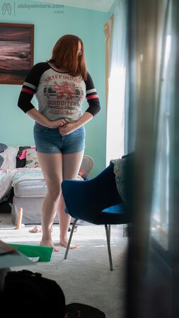Curvy redhead Breanna is going to show her black panties too