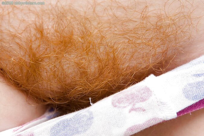 Redheaded seductress with a chubby bum is going to tease outside