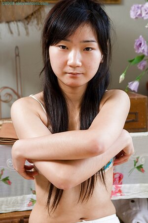 Aislin the adorable Asian is showing off her nips and beyond