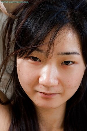 Aislin the adorable Asian is showing off her nips and beyond
