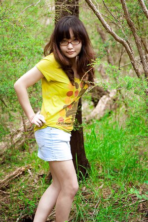 Adorable girl from Asia shows her firm backside as well