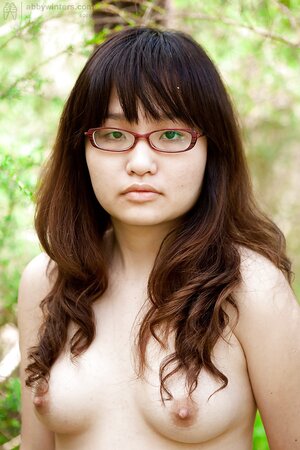 Adorable girl from Asia shows her firm backside as well