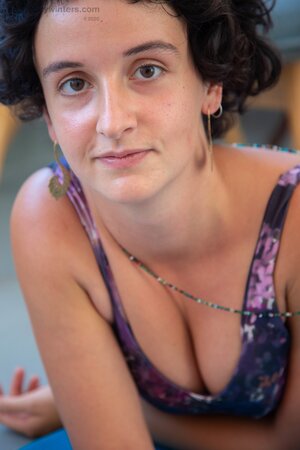 Brunette with big hair showing her small tits and great bush