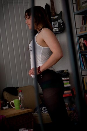 Brunette with natural breasts is going to show her backside too