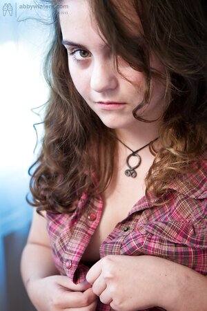 Brunette with a great smile shows how chubby she really is