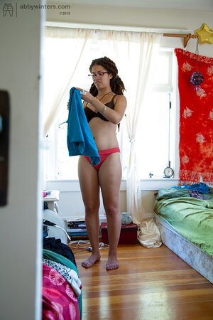 Geeky girl in glasses showing her meaty ass and teasing too