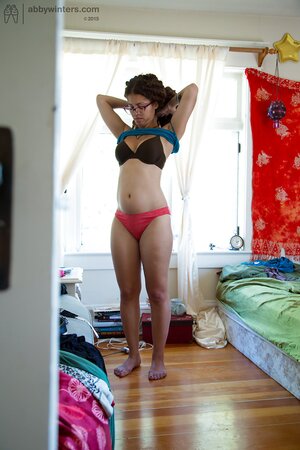 Geeky girl in glasses showing her meaty ass and teasing too