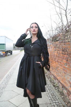 Brunette goth girl playing with her own tits in this one