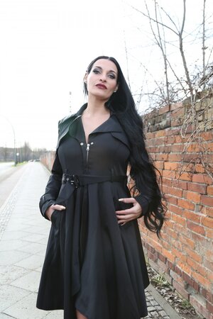 Brunette goth girl playing with her own tits in this one