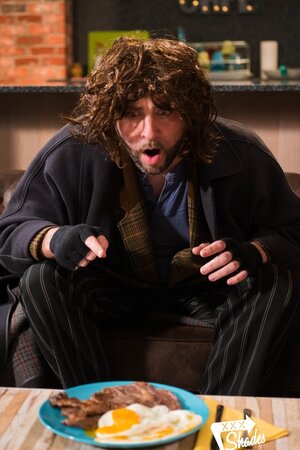 Dude in an awful hobo wig fucks a pretty blonde on the couch
