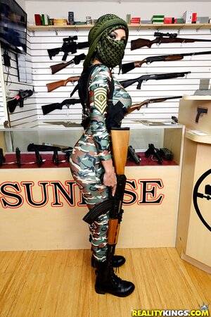 Girl in an offensive outfit is showing off her nice boobies
