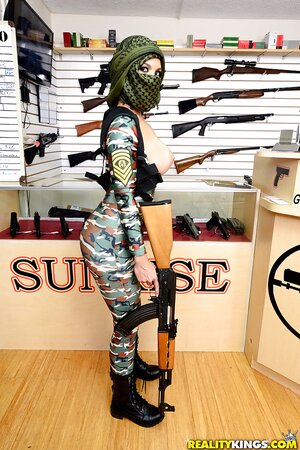 Girl in an offensive outfit is showing off her nice boobies