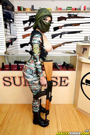 Girl in an offensive outfit is showing off her nice boobies