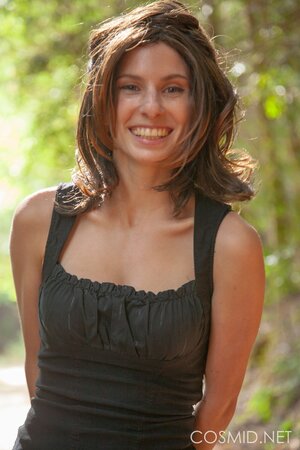 Pretty gal takes off her panties to showcase twat in the woods