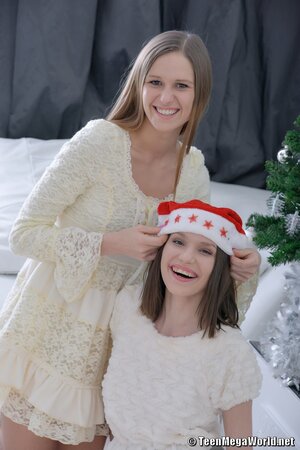 Two horny ladies are all about threesome fucking on Christmas