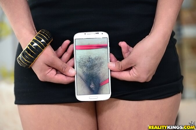 Latina is taking sexy photos of her hairy pussy and fingers it