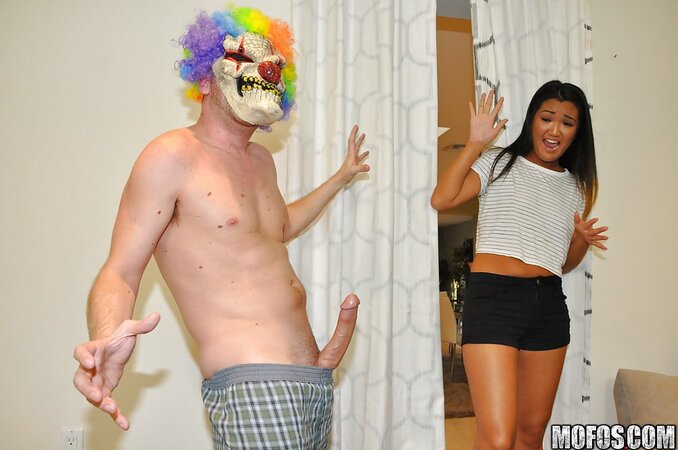 Asian teen enjoys playing with a dick after the Halloween party