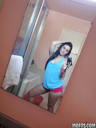 Saucy stunner taking some selfies in the bathroom while stripping
