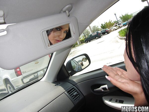 Superb whore with fake boobs showing off her naked body in the car