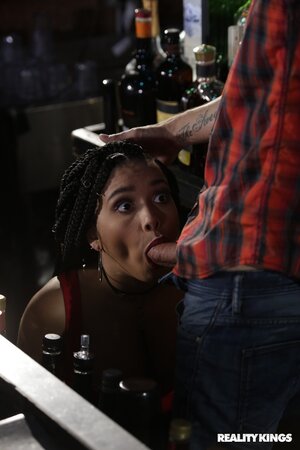 Slender black beauty is getting banged at the bar by a BWC