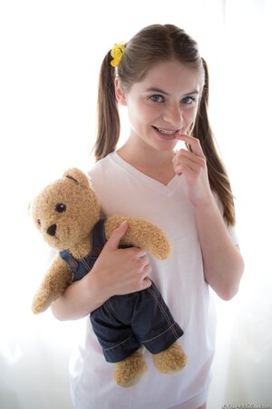 Innocent teen enters the room with Teddy in hands and puts it aside to strip